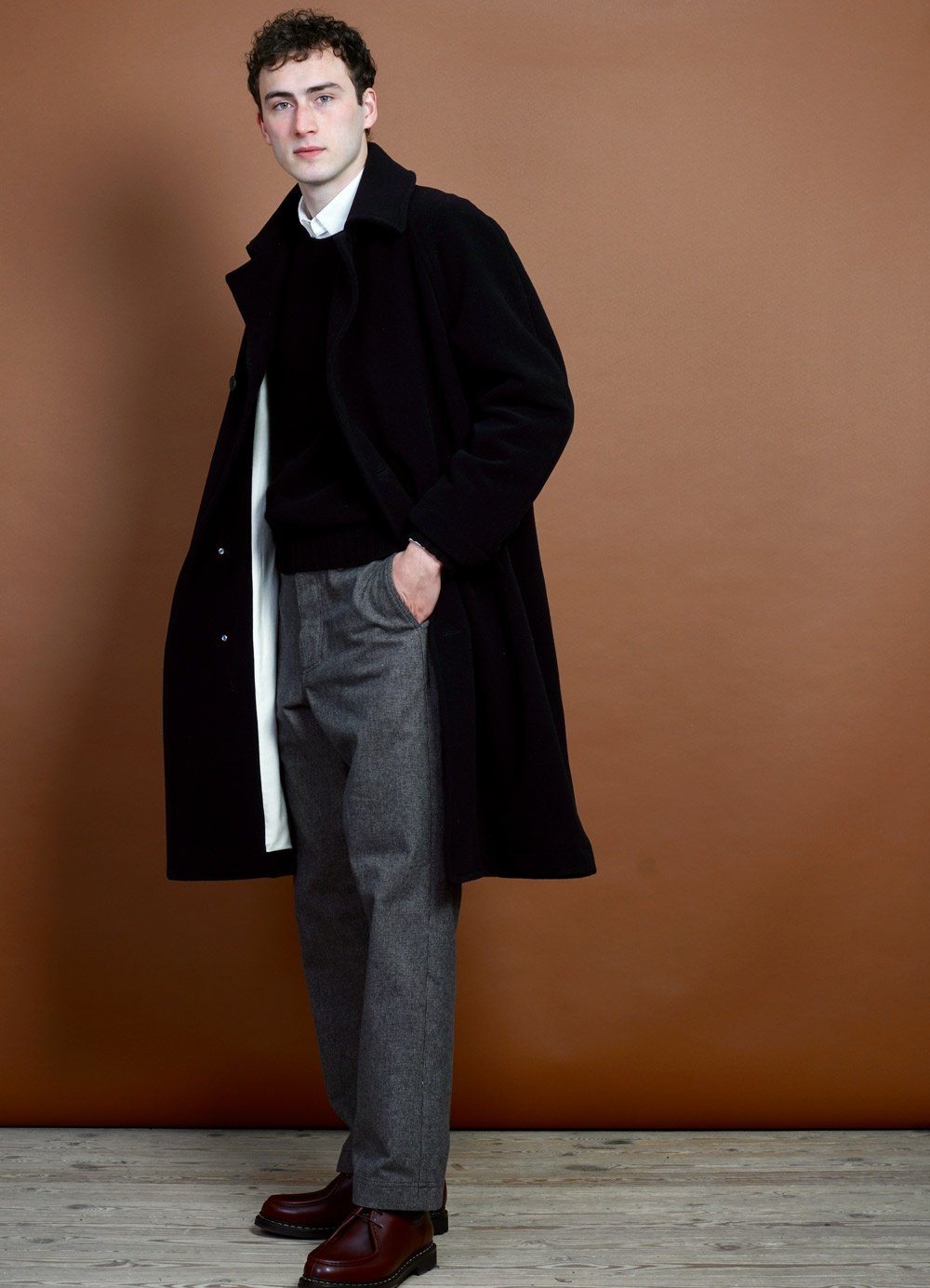 https://hansengarmentsstore.com/cdn/shop/products/sigurd-long-lined-wool-coat-black-hansen-garments-660549.jpg?v=1634327082&width=1000